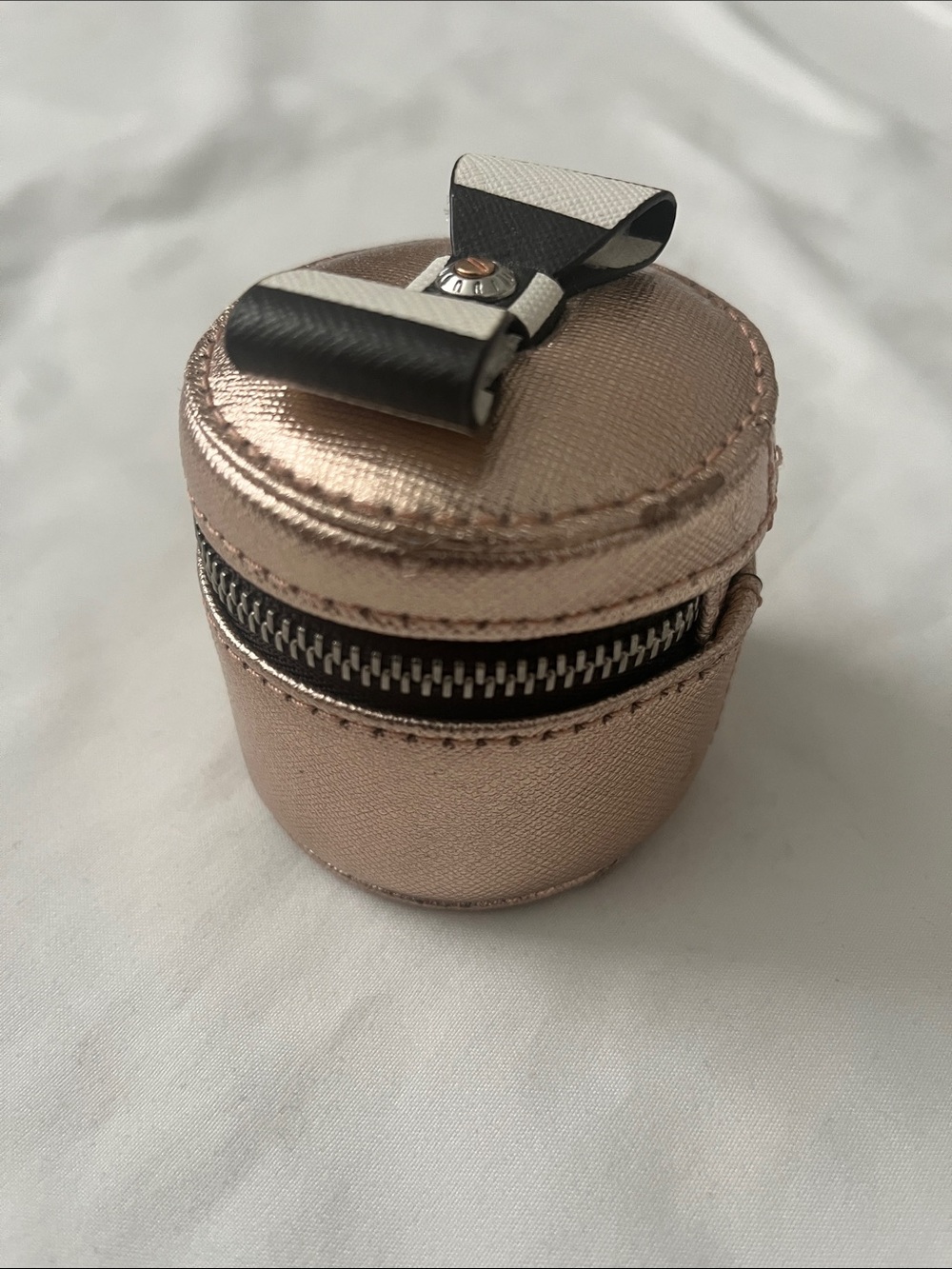 henri bendel Rose Gold Round Jewelry Case with Black & White Bow